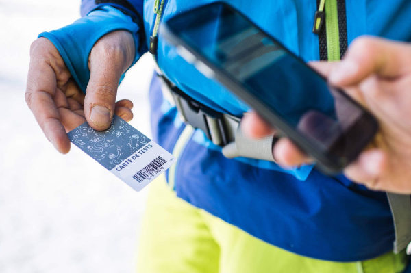 The Digital Test Center mobile app being used to scan a tester’s badge